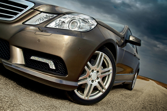 Front wheel, bumper and light detail of a modern sporty luxury car