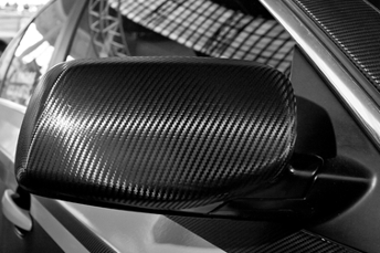 Front wheel, bumper and light detail of a modern sporty luxury car